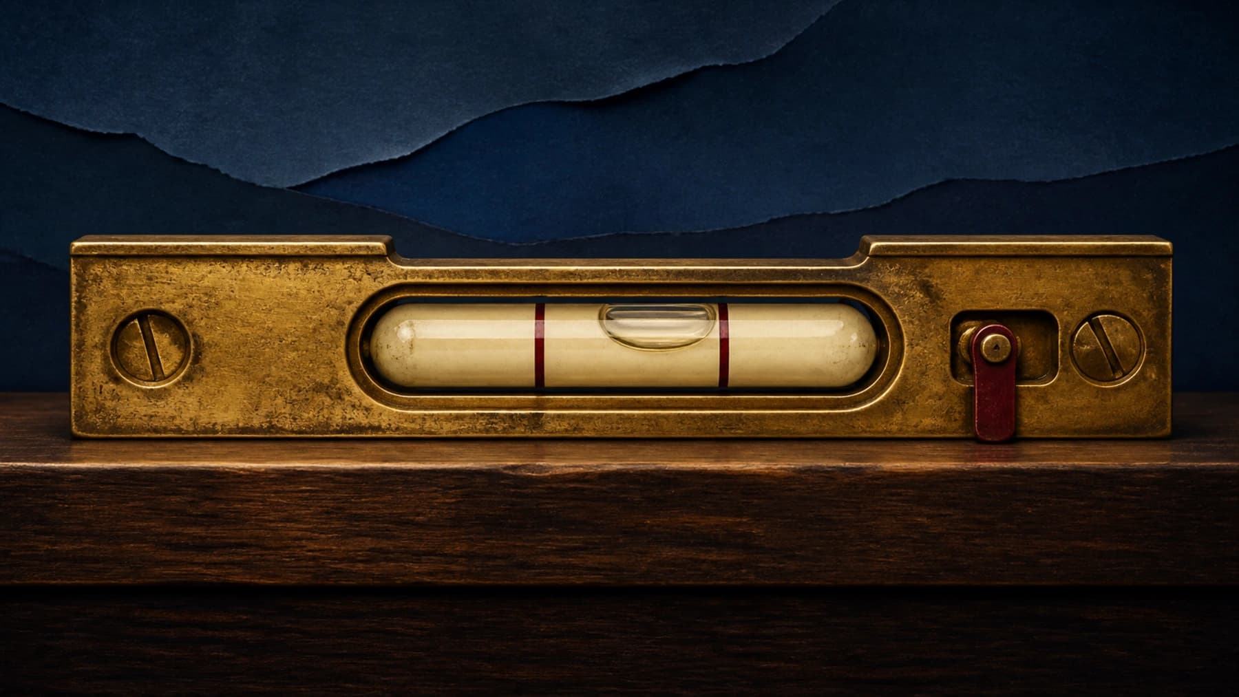 An aged-brass spirit level with a cream glass vial, oxblood calibration band and engaged safety catch represents calibrated AI abstention.